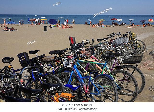 Italy - Veneto Region - Venice Province - Cavallino-Treporti. Bikes on the beach near Punta Sabbioni lighthouse