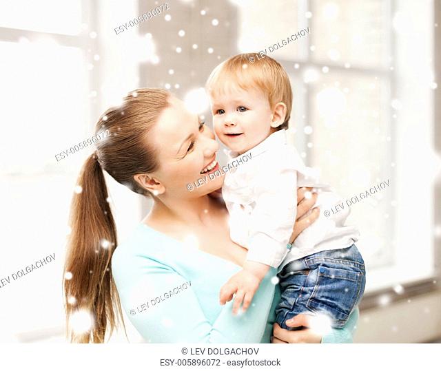family, children, christmas, x-mas, love concept - happy mother with adorable baby