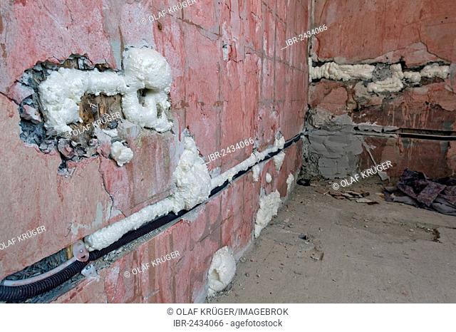 Cable channels, wall cavities filled with foam insulation, renovation of an old building, Stuttgart, Baden-Wuerttemberg, Germany, Europe