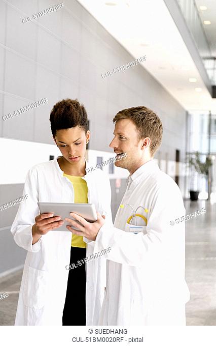 Doctors using tablet computer