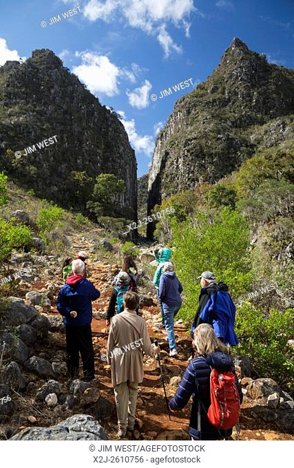 Santiago Apoala, Oaxaca, Mexico - Tourists hike near the village of Apoala, a small mountain town inhabitated by the Mixtec ethnic group