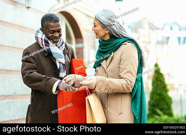Storytelling image of a multiethnic senior couple in love