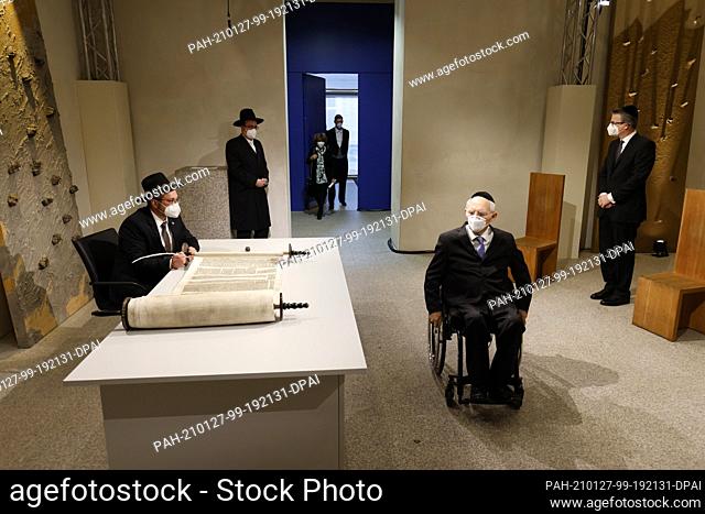 27 January 2021, Berlin: Rabbi Shaul Nekrich (l) sits at a table as Bundestag President Wolfgang Schäuble (CDU, front, r)