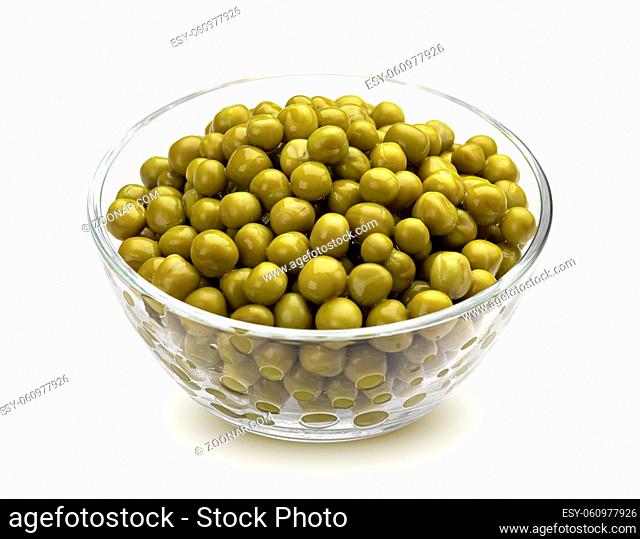 Canned green peas in glass bowl isolated on white background with clipping path