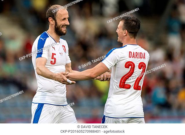 Roman Hubnik, left, and Vladimir Darida of Czech Republic smile during a friendly soccer match between Czech Republic and Malta in Kufstein, Austria, May 27