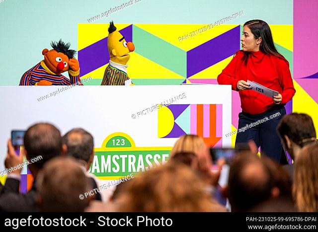 25 October 2023, Bavaria, Munich: Moderator Aline Abboud chats with the characters Ernie and Bert from the TV show ""Sesame Street"" during the opening of the...