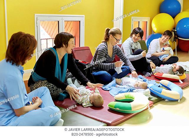 Mothers and babies at breastfeeding education program
