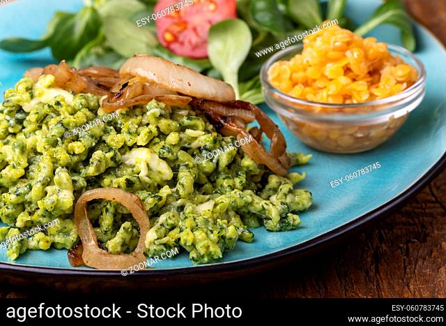 bavarian spinach spaetzle on a blue plate