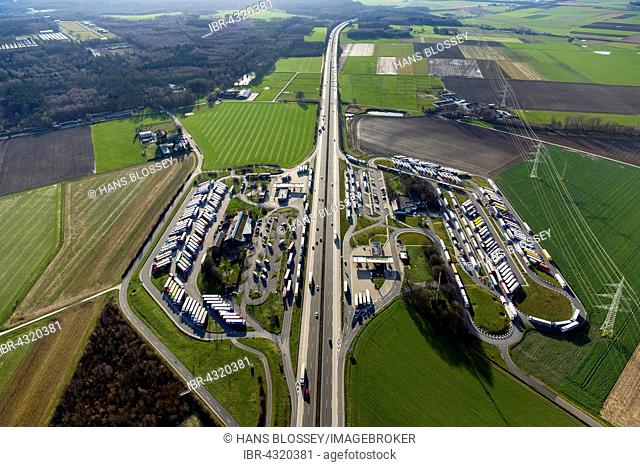 Aerial view, Aachener Land motorway service area with full parking lot, trucks parking, herringbone, Eschweiler, Rhineland, North Rhine-Westphalia, Germany