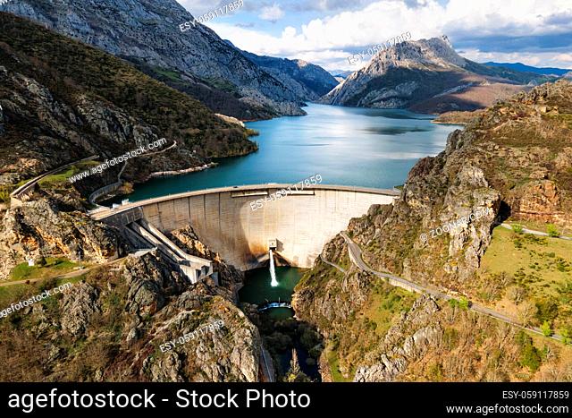 Aerial view of Water dam and reservoir lake, generating hydro electricity power renewable energy and sustainable development. High quality photo