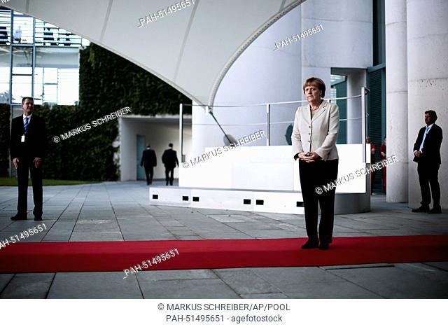 German Chancellor Angela Merkel waits for the arrival of the participants for a 'West Balkan Conference' at the chancellery in Berlin, Thursday, Aug