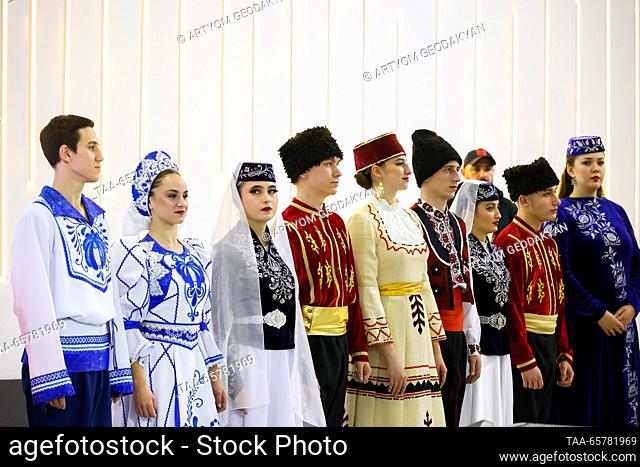 RUSSIA, MOSCOW - DECEMBER 15, 2023: Participans in Crimea Day display traditional costumes during the Russia Expo international exhibition and forum at the...