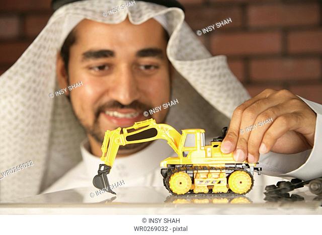 Arab Man with a toy truck