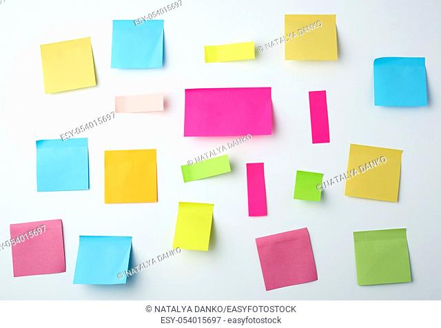 multicolored blank paper stickers of different sizes and shapes on a white background