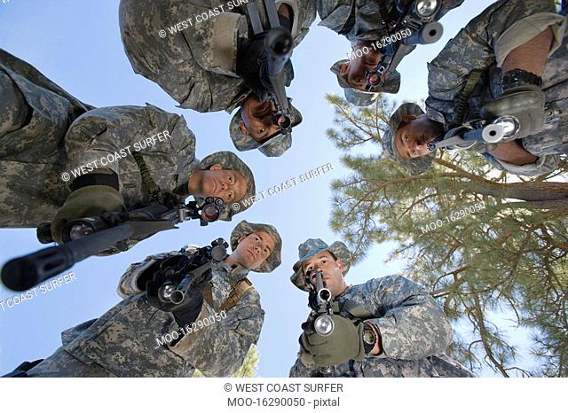 Low angle portrait of armed soldiers