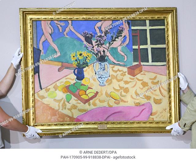 The work ""Still Life with The Dance""Â (1909) of the French artist Henri Matisse is prepared for the exhibition by the artists Bjarte Gismarvik (L) and Guenter...
