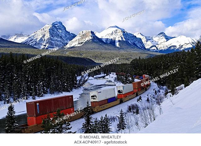 Train at Morant's curve with Haddo Peak, Saddle Mountain, Fairview Mountain in the background, Banff National Park, Alberta, Canada