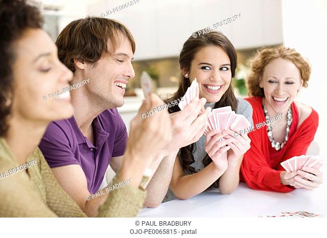 Friends playing cards together