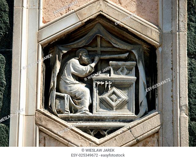 Florence - The hexagonal Relief on the Giottos' Campanile.The hexagonal panels on the lower level depict the history of mankind, inspired by Genesis