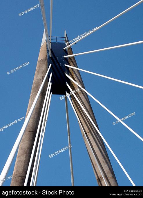 a view of the tower and cables on the marine way suspension bridge in southport merseyside against a blue summer sky