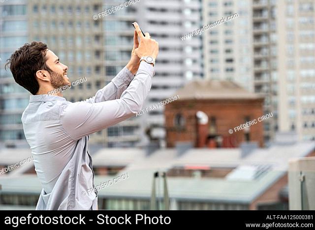 Young man taking selfie