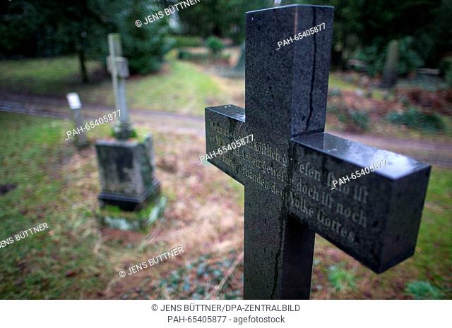 A grave stone in the shape of a cross is seen at the old cemetery in Schwerin, Germany, 27 January 2016. On 28 January 2016 the Parliament of...