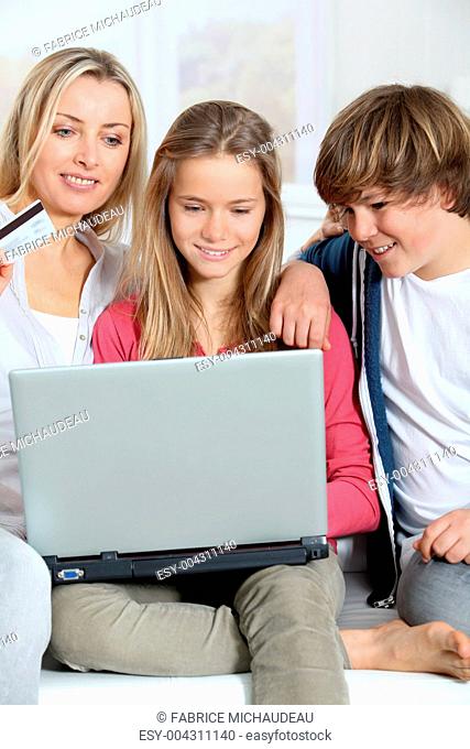 Mother and children at home doing online shopping