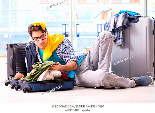 Young man preparing for vacation travel