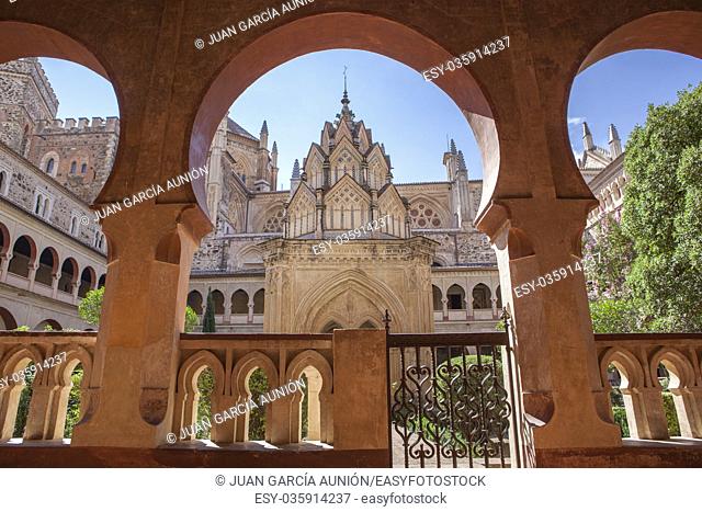 Guadalupe Monastery cloister from open arcade. Mudejar arches detail. Caceres, Spain