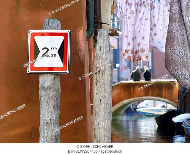 high water sign at a canal in Cannarégio, Italy, Venice