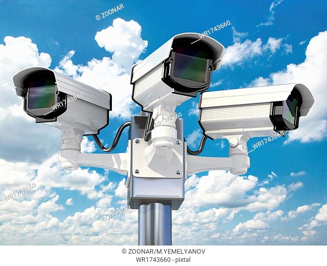 CCTV security camera on cloud sky background
