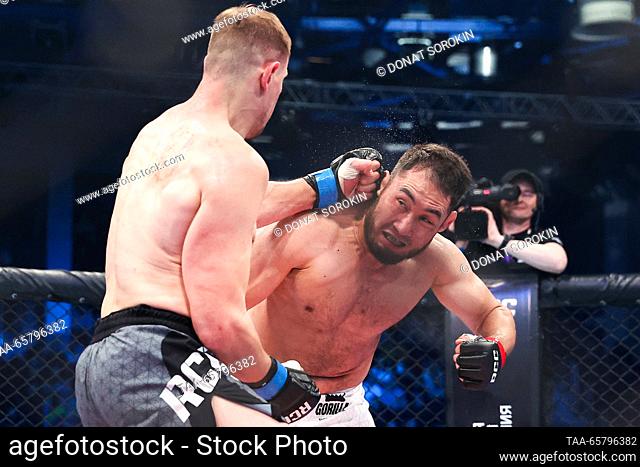 RUSSIA, YEKATERINBURG - DECEMBER 15, 2023: MMA fighters Maxim Grishin (L) of Russia and Asylzhan Bakhytzhanuly of Kazakhstan fight in their light heavyweight...