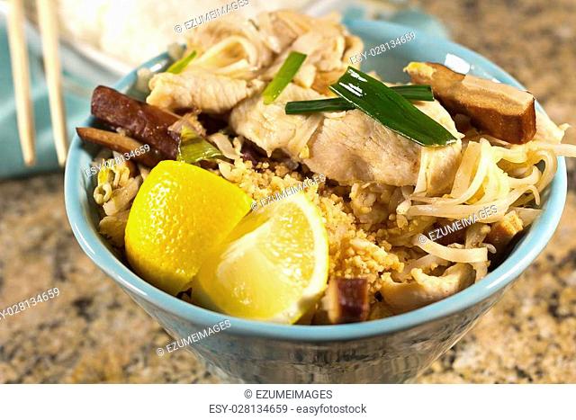 Delicious Chicken Pad Thai with lemon and white rice