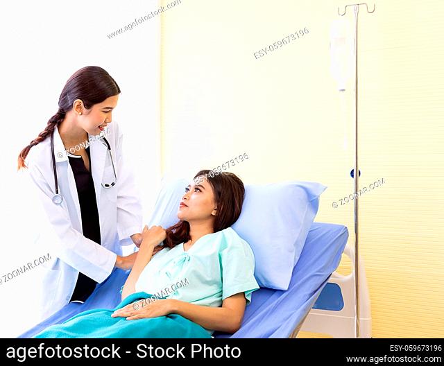 medical doctor touch on patient's sholder to cheer up patient
