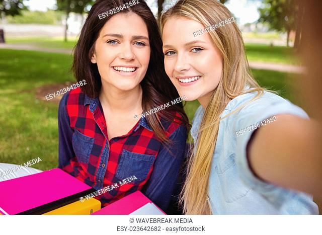 Smiling students studying outdoor