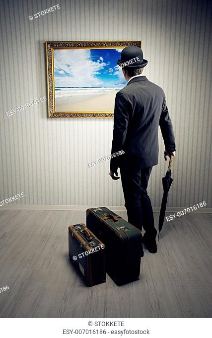 Businessman with suitcase dreams about a holiday