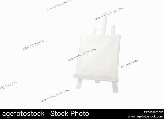 White easel in front of a white background