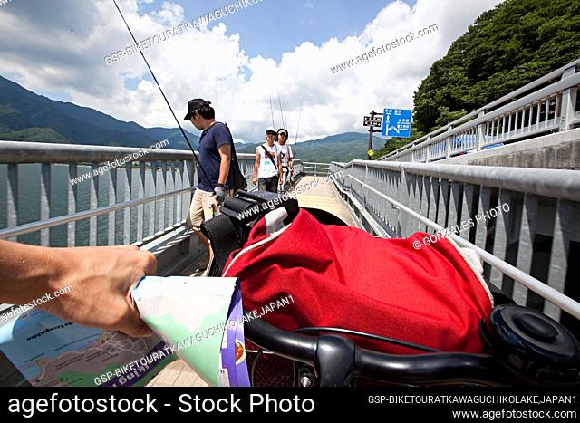 Biking through the Kawaguchi Lake in southern Yamanashi Prefecture near Mount Fuji, Japan