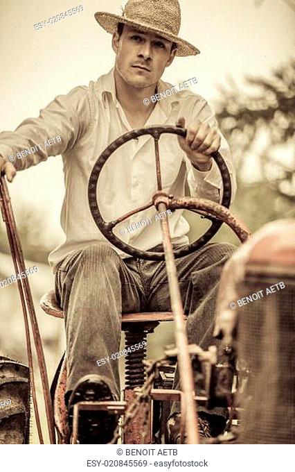 Young Farmer on a Vintage Tractor