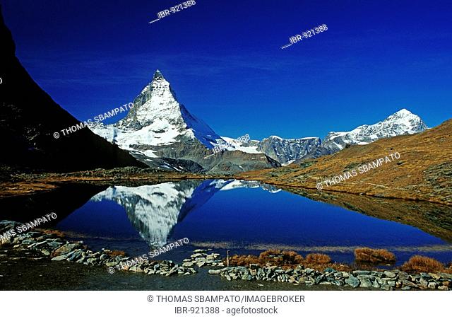 Matterhorn reflected in a mountain lake, Switzerland, Europe