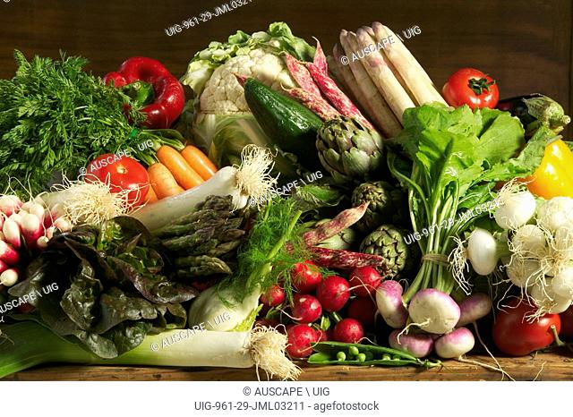 Variety of vegetable including leeks, radishes, baby turnips, white onions, white apsaragus, capsicums, green pepper, globe artichoke, green asparagus, fennel