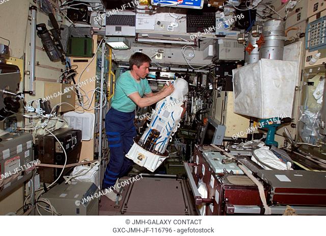 Cosmonaut Sergei K. Krikalev, Expedition 11 commander representing Russia's Federal Space Agency, works with the European Space Agency (ESA) Matroshka radiation...
