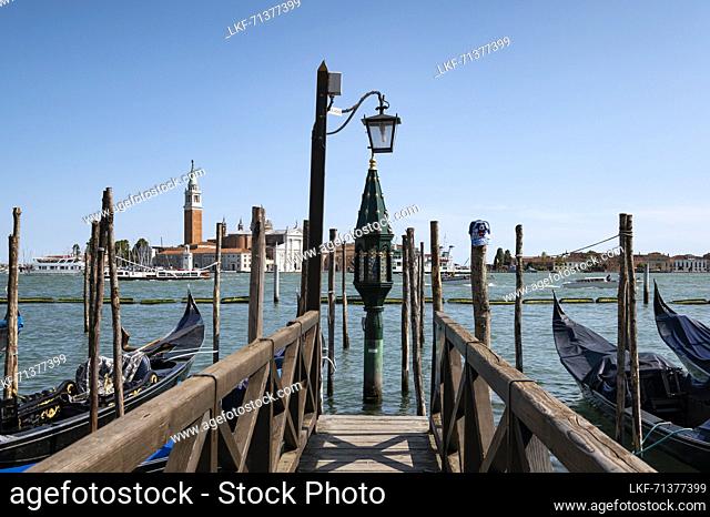 View of the lantern of the gondola station on St. Mark&#39;s Square in the background the island of San Giorgio, Venice, Veneto, Italy, Europe