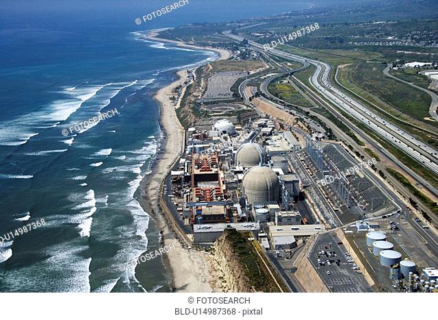 Aerial of nuclear power plant on California coast, USA