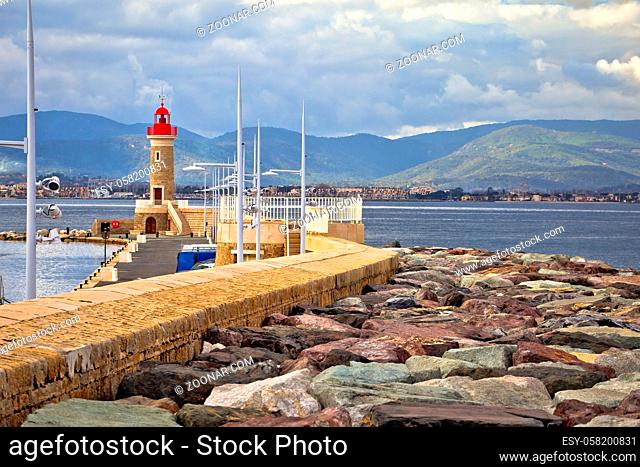Saint Tropez, French riviera. Lighthouse and breakwater of Saint Tropez harbor, Alpes-Maritimes department in southern France