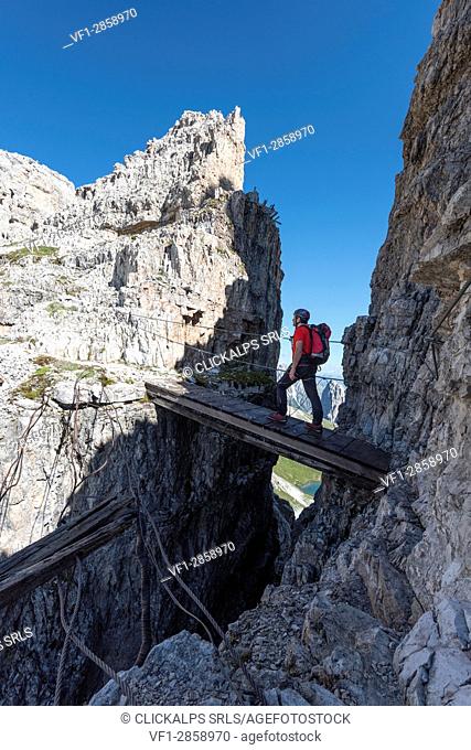 Sesto/Sexten, Dolomites, South Tyrol, province of Bolzano, Italy. Climber on the via ferrata ""Path of Peace"" to the mountain of Monte Paterno
