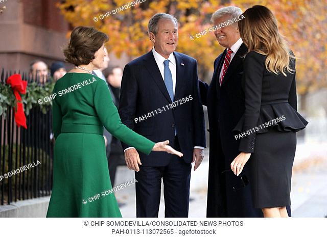 Former first lady Laura Bush and former President George W. Bush greet President Donald Trump and first lady Melania Trump outside of Blair House December 04
