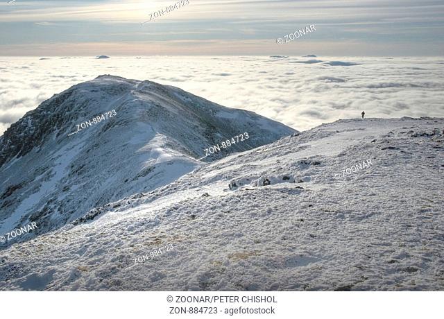 Hillwalker approaching the summit of Ben Challum