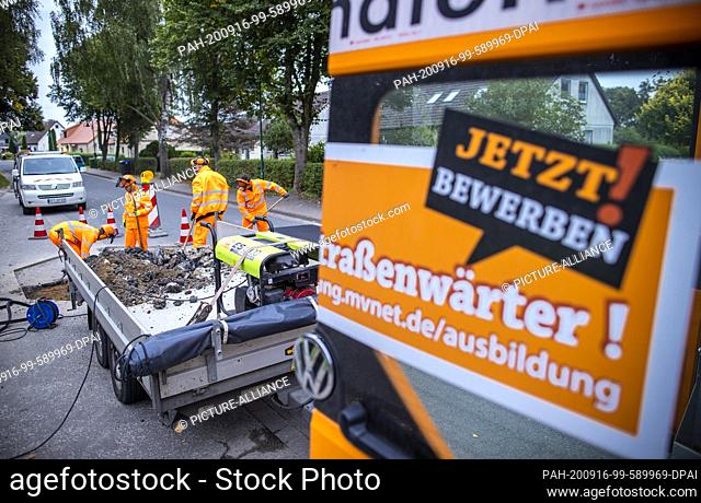 09 September 2020, Mecklenburg-Western Pomerania, Walkendorf: Trainees in their second year of training break up the old road surface at a bus stop and prepare...