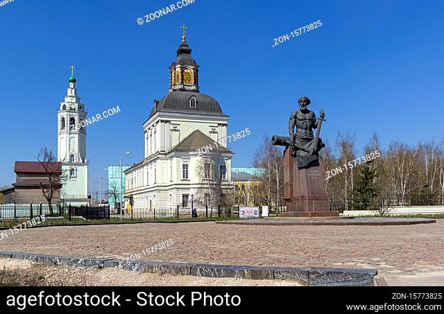 Tula, Russia - April 24, 2019: Monument to Nikita Demidov, the founder of the Demidov dynasty, on the background of the Nikolo-Zaretskogo church